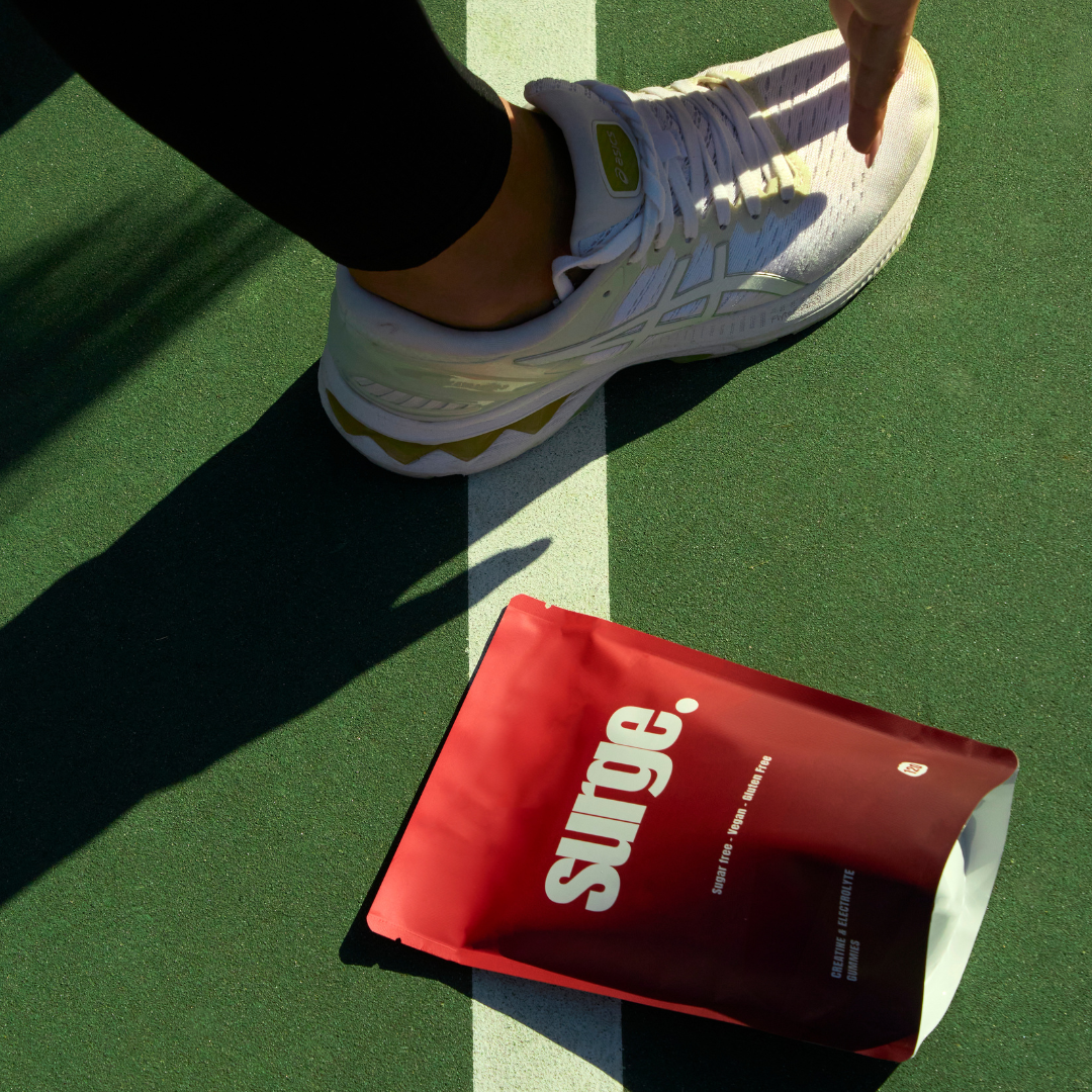 Close-up of a single green leaf against a white background.